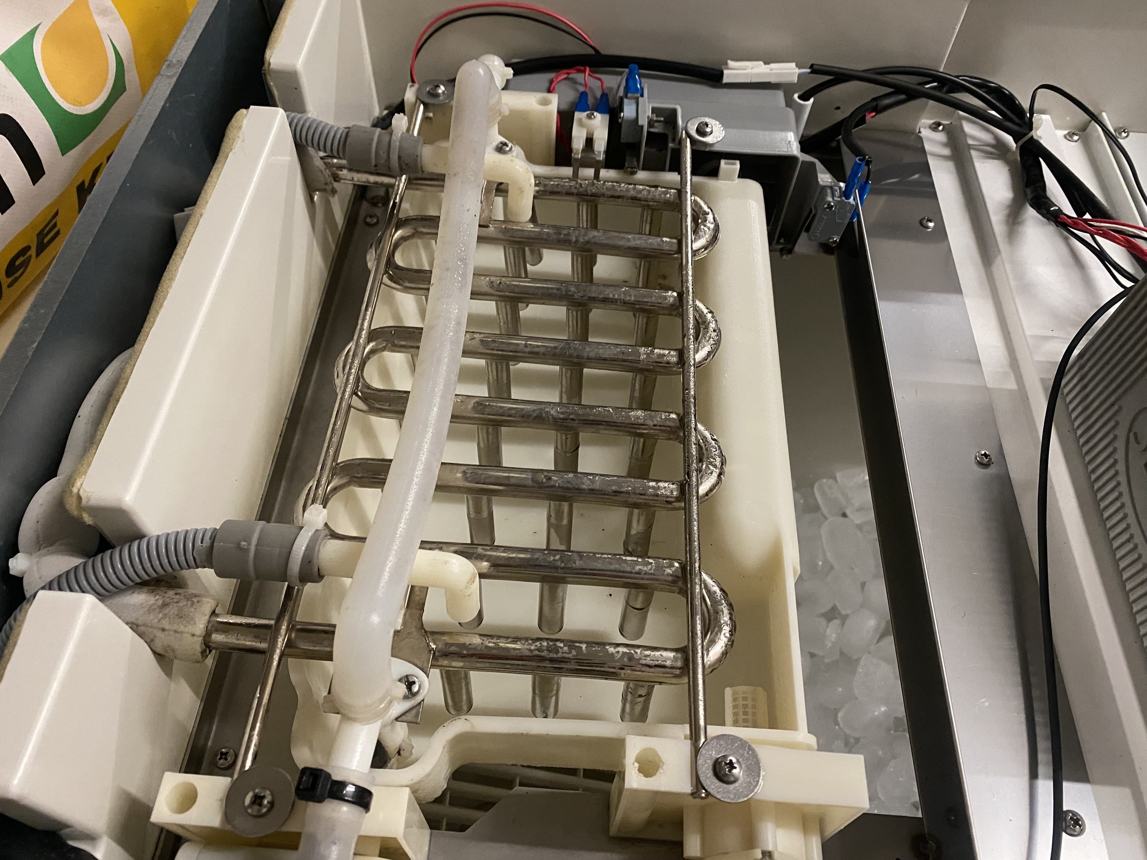Commercial ice machine components being serviced
